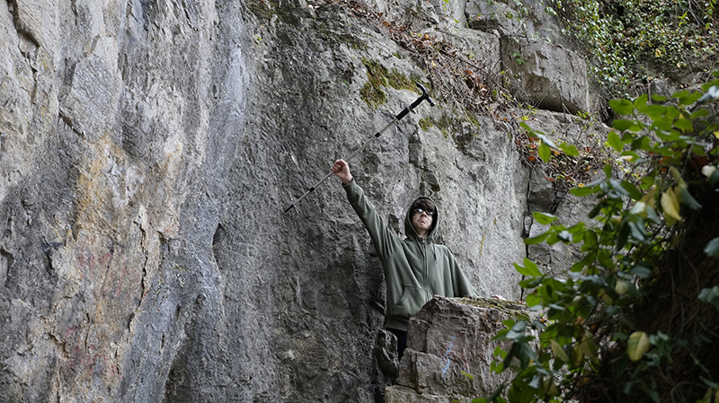 Arthur holding his walking stick up high