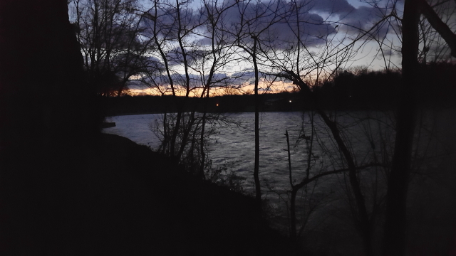 Photograph of the river and towpath with more light just before dawn.