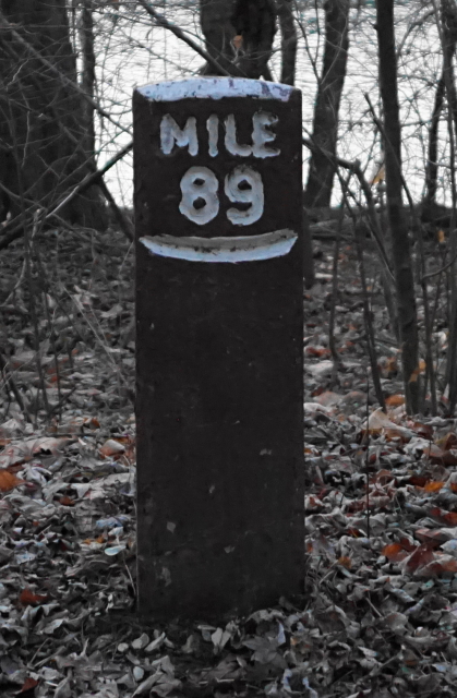 Concrete mile marker post.